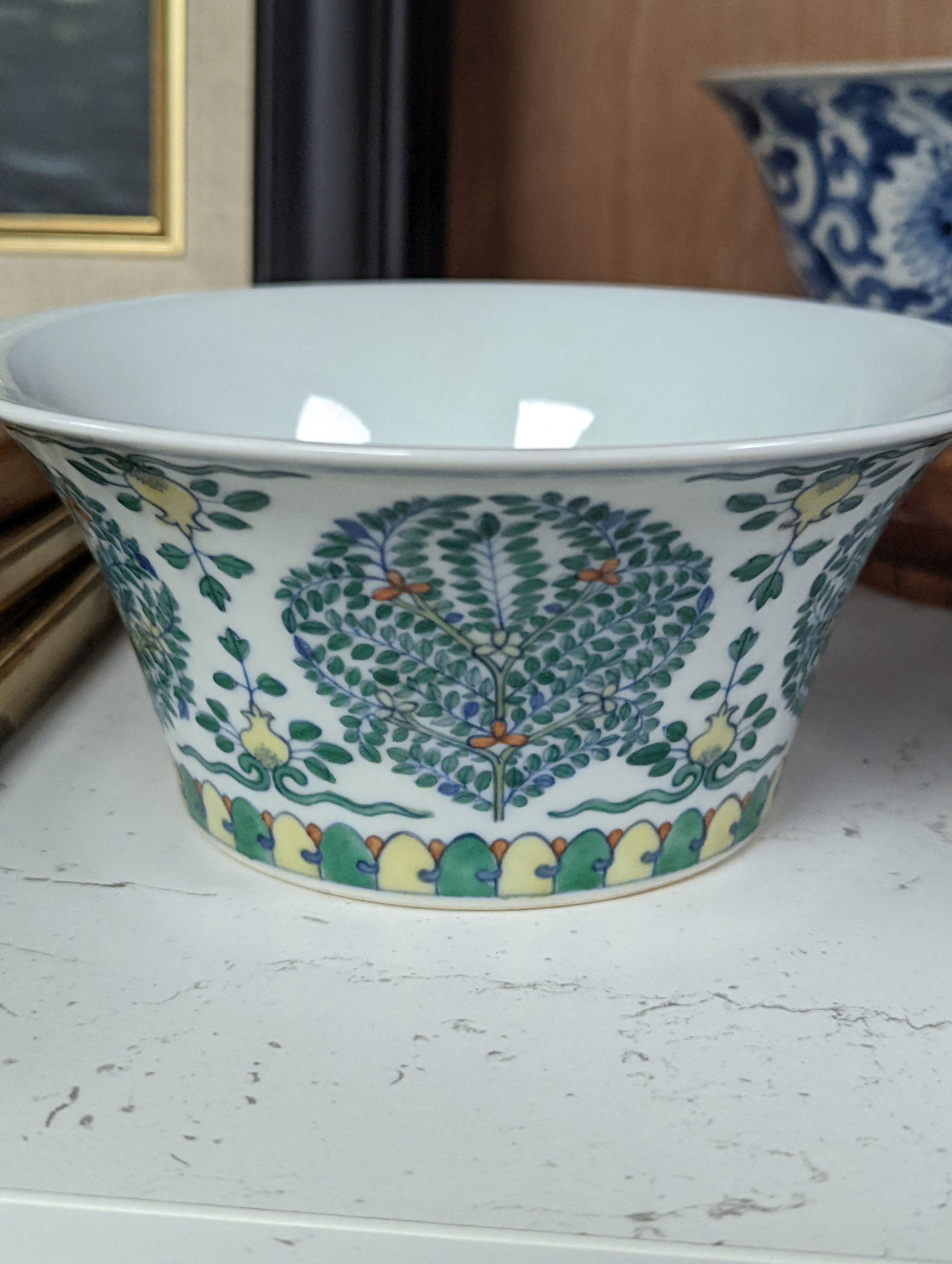 A Chinese blue and white bowl, Kangxi, 15cm. diam., a famille rose teapot stand, Yongzheng, and two doucai bowls